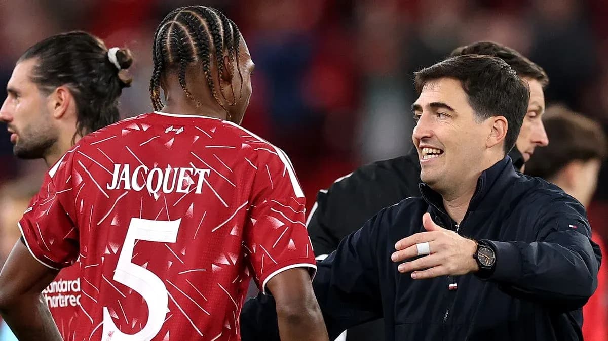 Player Jacquet interacting with coach after match