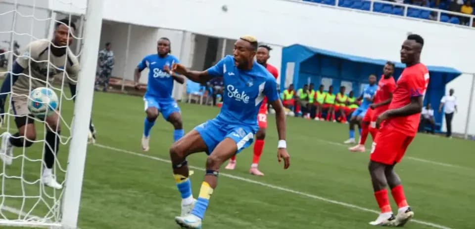 Player kicking ball near goal in NPFL match