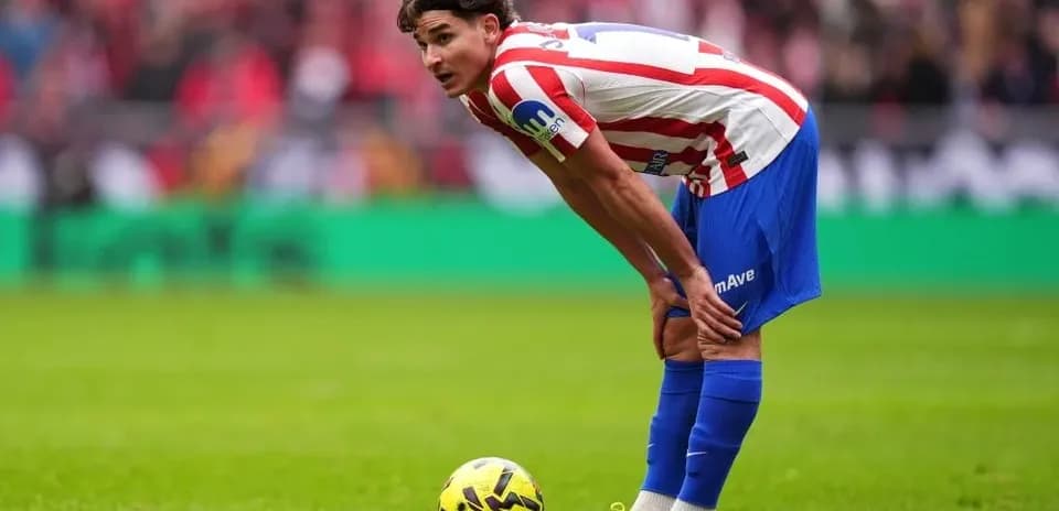 Player preparing to take a free kick during match
