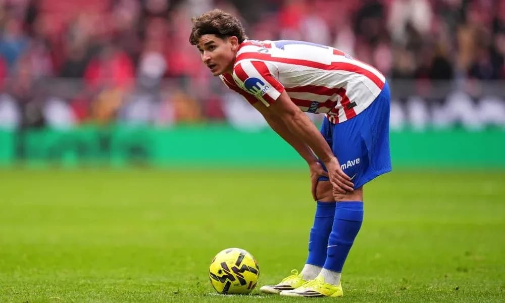 Player preparing to take a free kick during match
