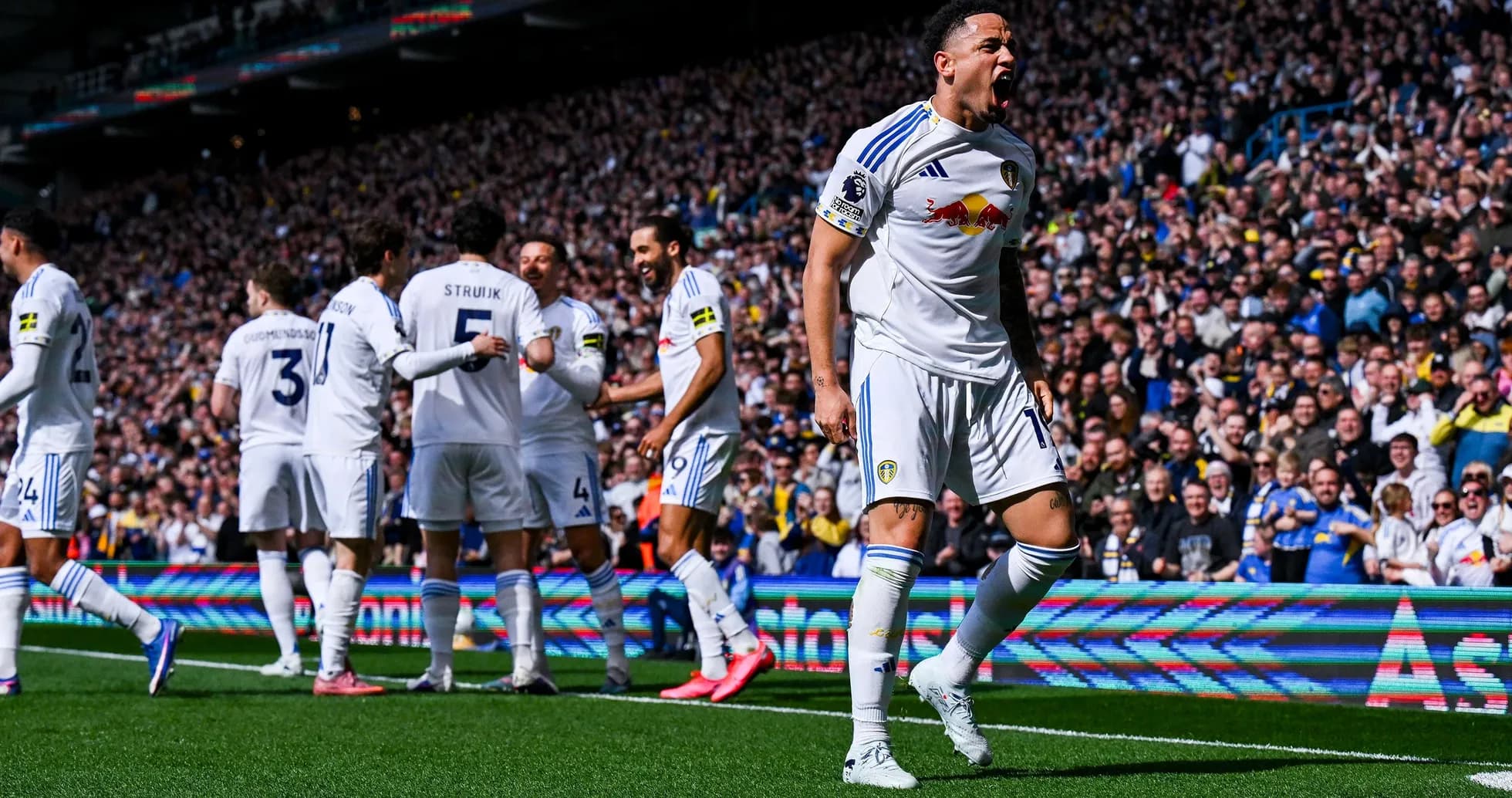 Leeds players celebrating a goal during match