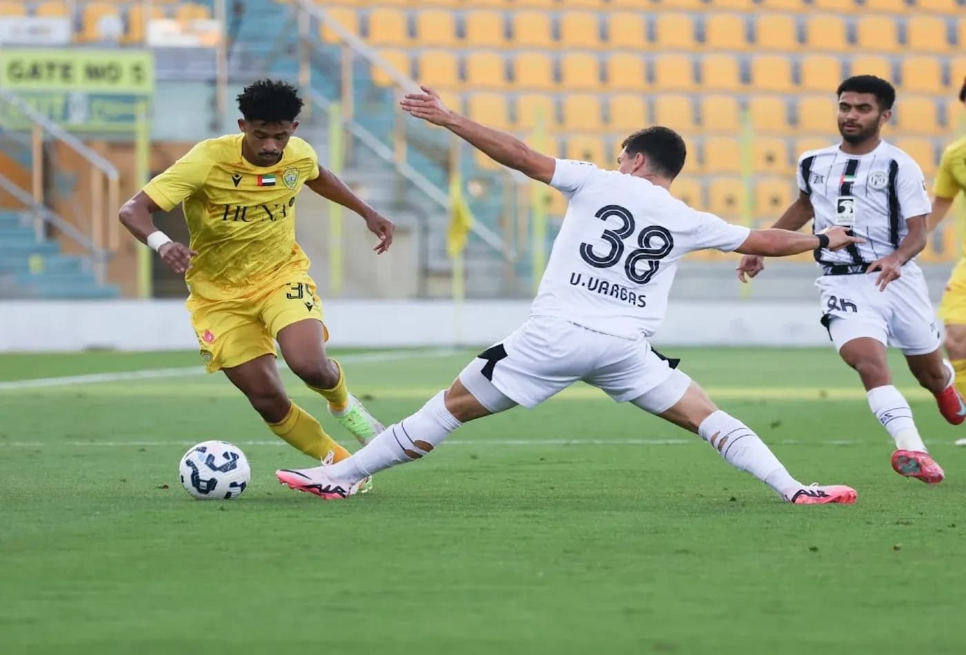 Al Wasl U23 player dribbling past Al Jazira U23 opponent