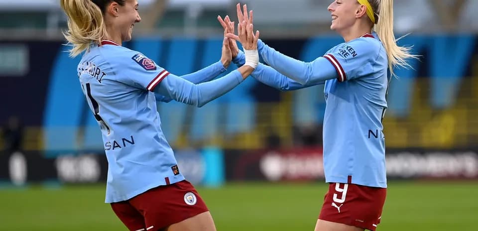 Manchester City W players celebrating a goal
