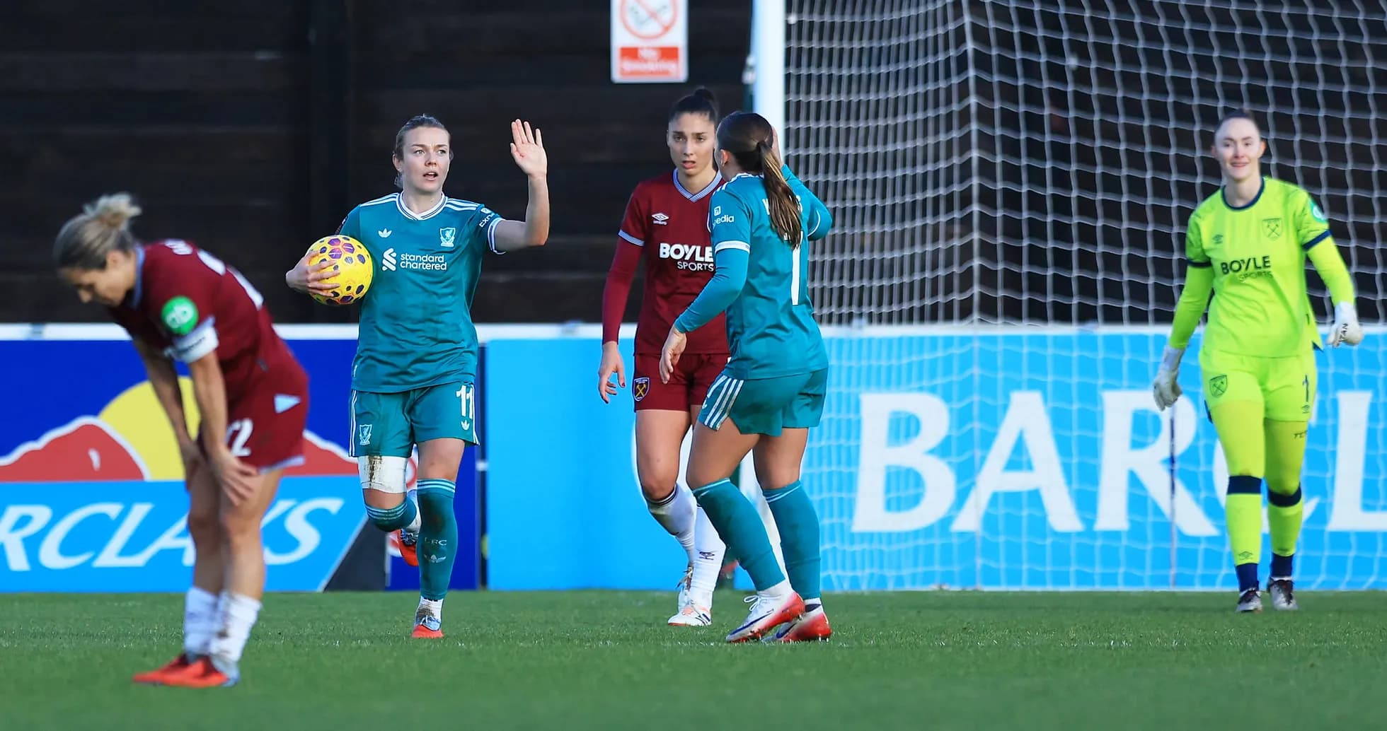 Liverpool W players celebrating during FA WSL match
