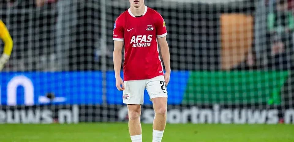 Player in red jersey standing on the field