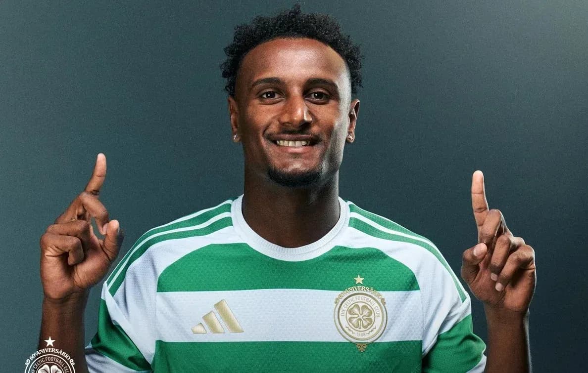 Player posing in Celtic FC jersey with raised fingers