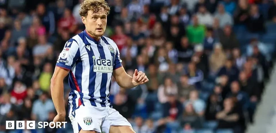 Player in striped West Bromwich Albion kit on field