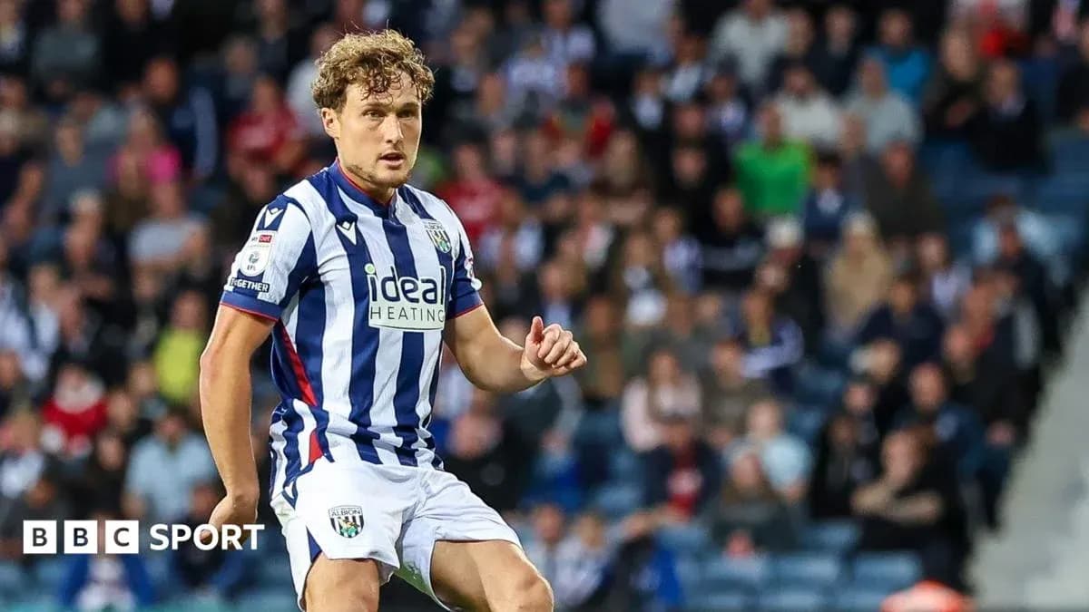 Player in striped West Bromwich Albion kit on field