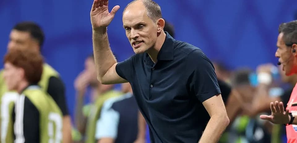 Coach gesturing during a match on the sidelines