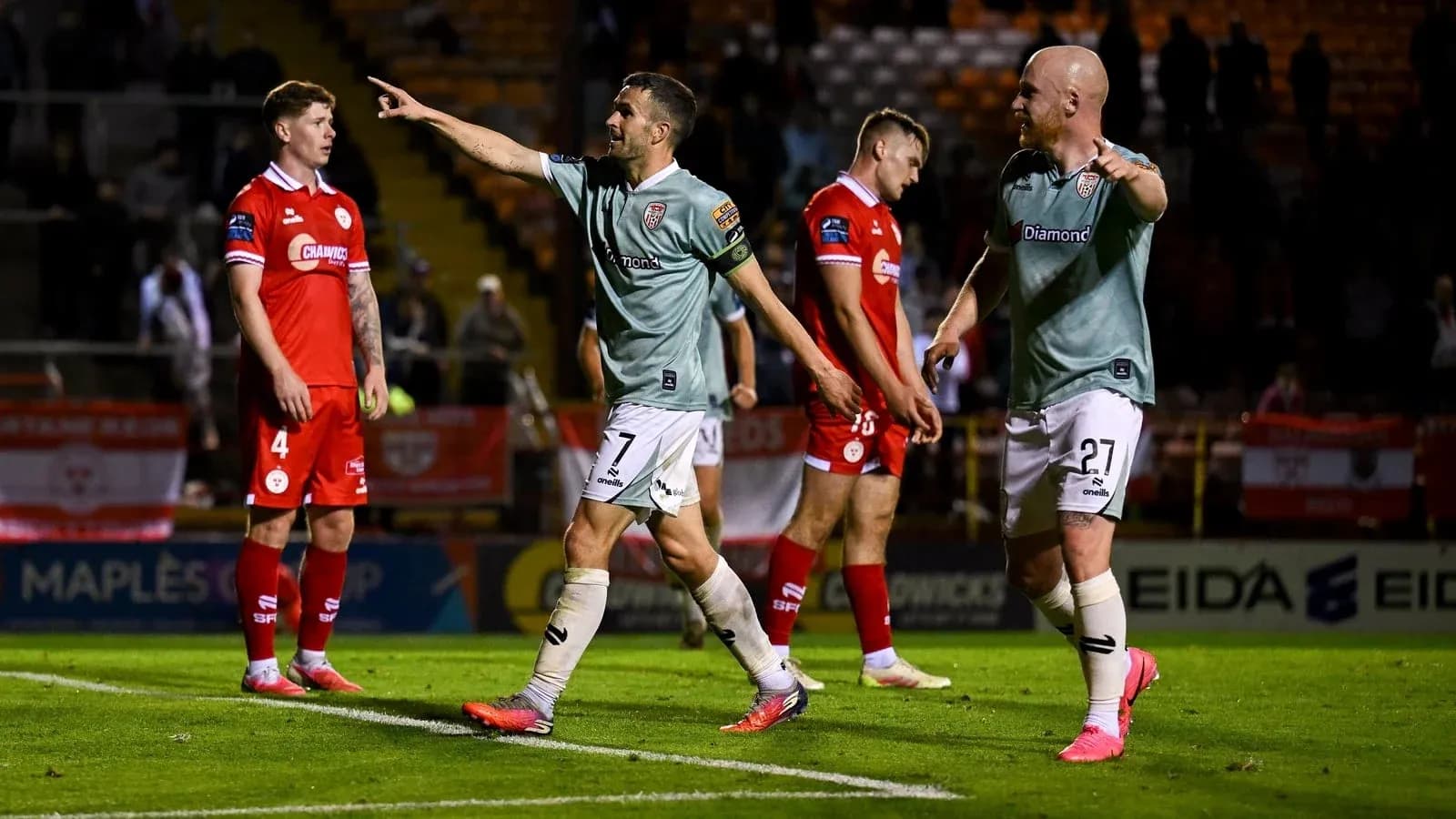 Players celebrating a goal during a football match