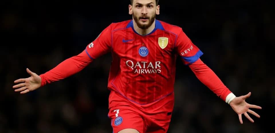 Player celebrating a goal in red PSG jersey