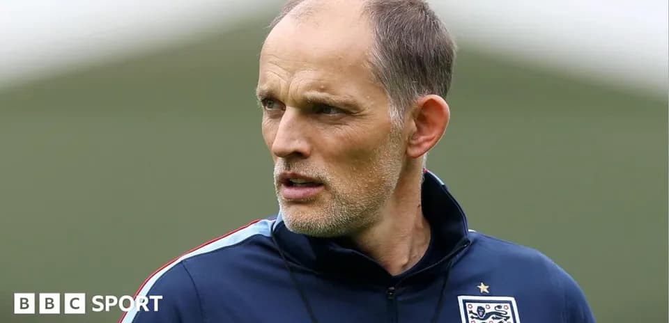 Football coach observing training session on field