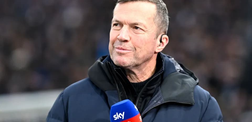 Sports commentator speaking into microphone on field