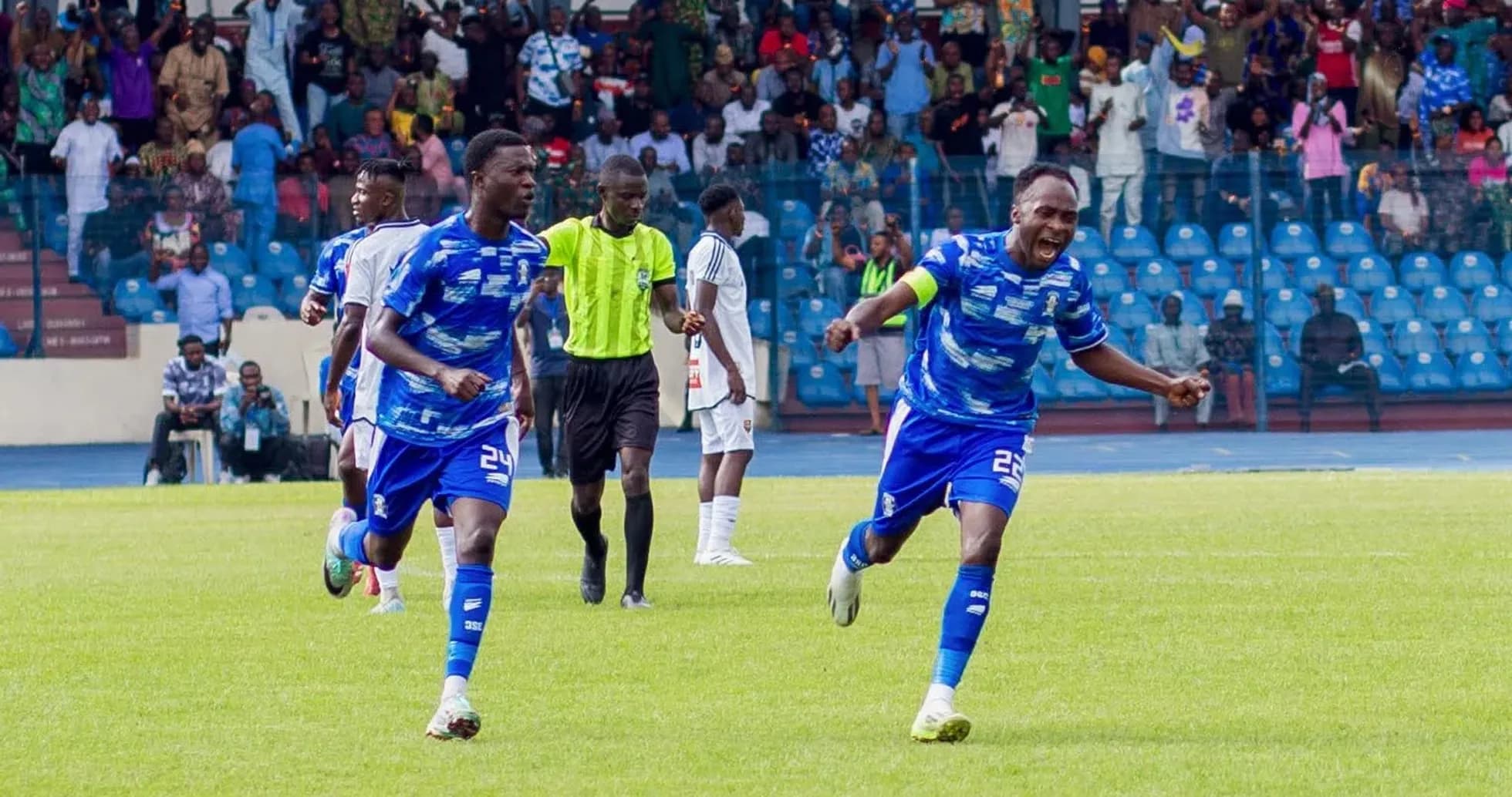 Players celebrating goal during Warri Wolves match