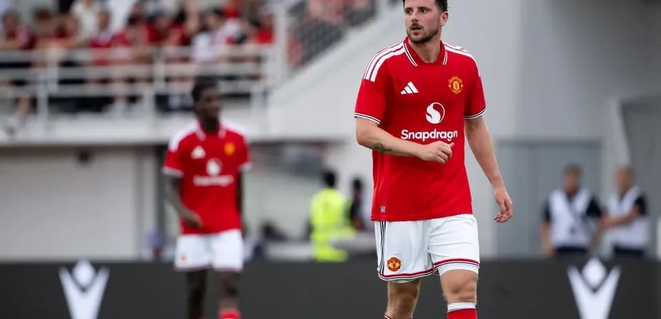 Player walking on field during Manchester United match