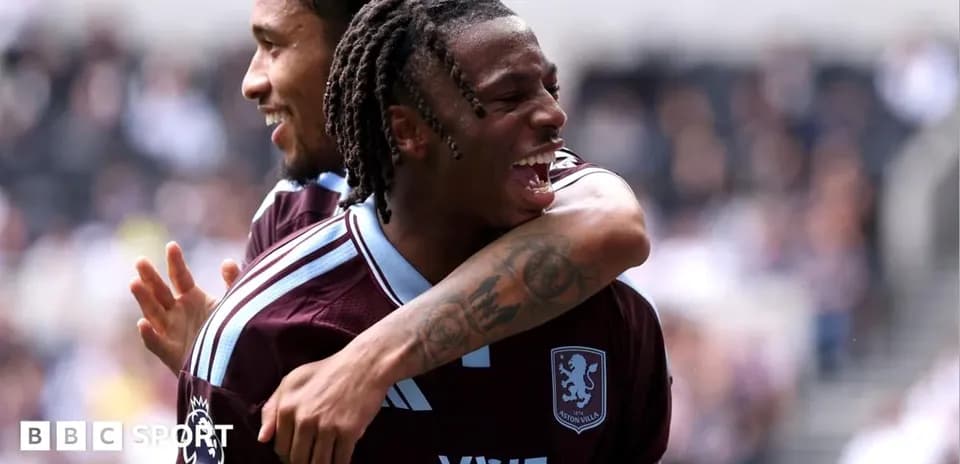 Aston Villa players celebrating a goal together