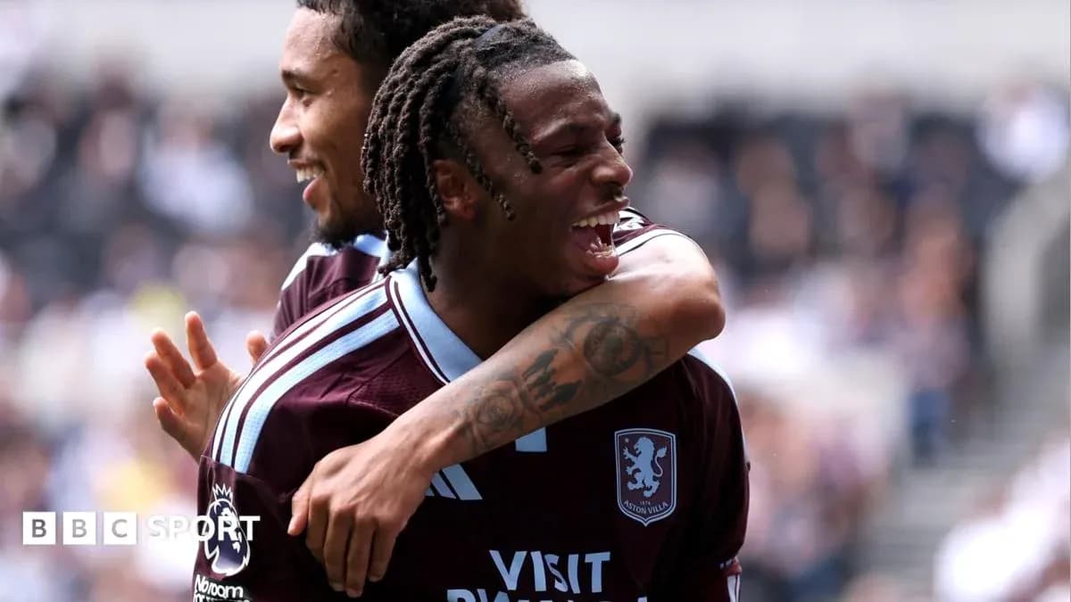 Aston Villa players celebrating a goal together