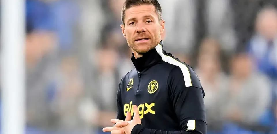 Coach giving instructions on the sidelines during match