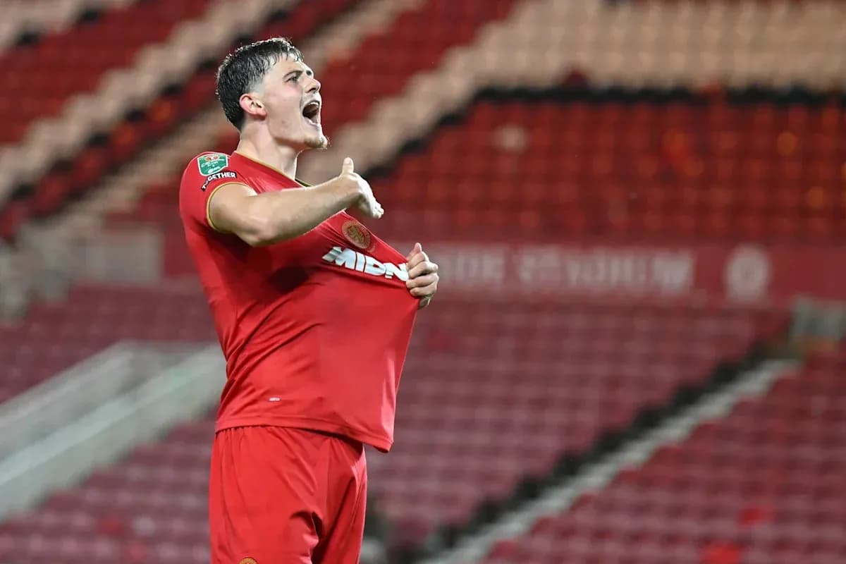 Player celebrating and lifting shirt after scoring goal