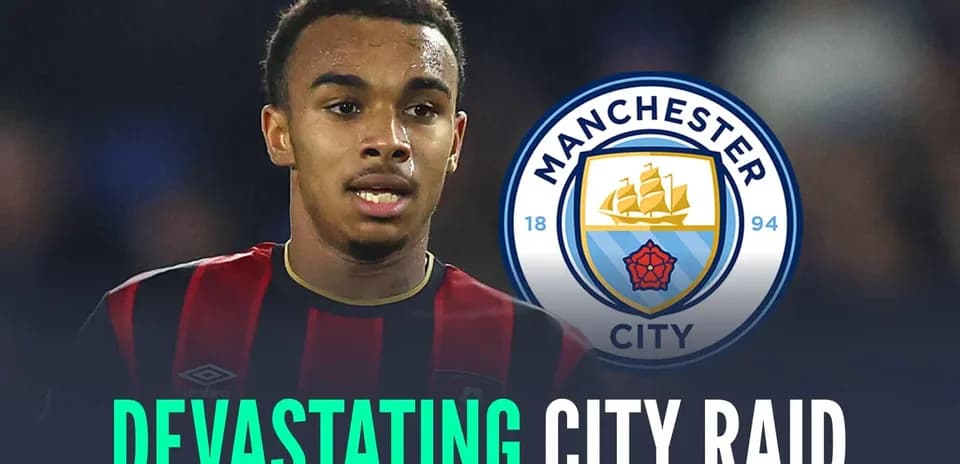 Player in black and red kit with Manchester City logo