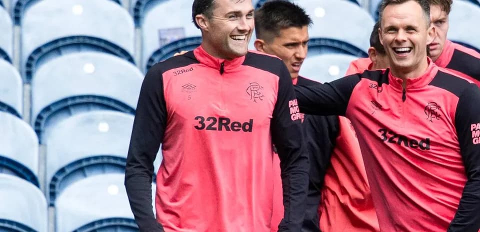 Players laughing during training session in team gear