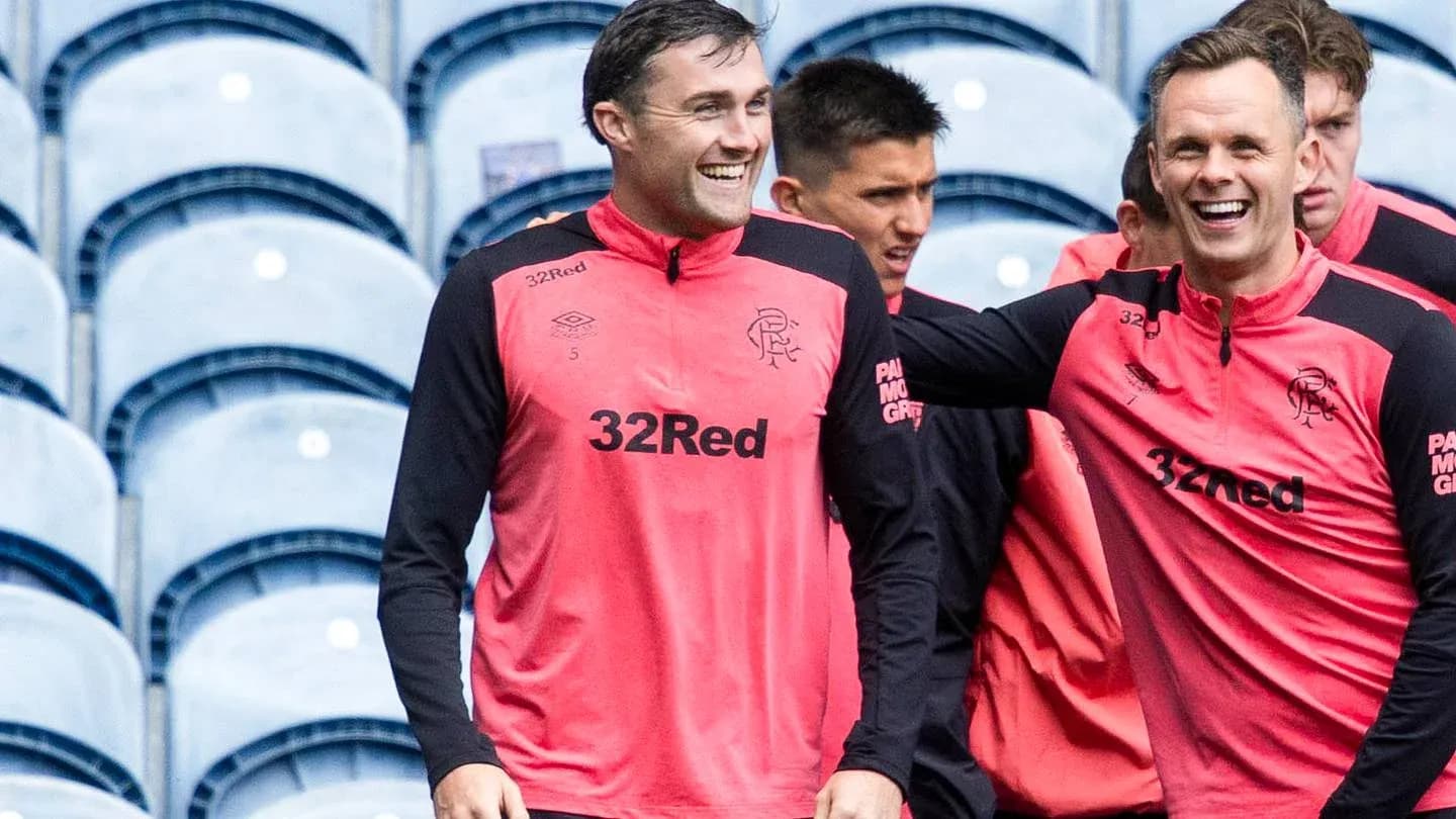 Players laughing during training session in team gear