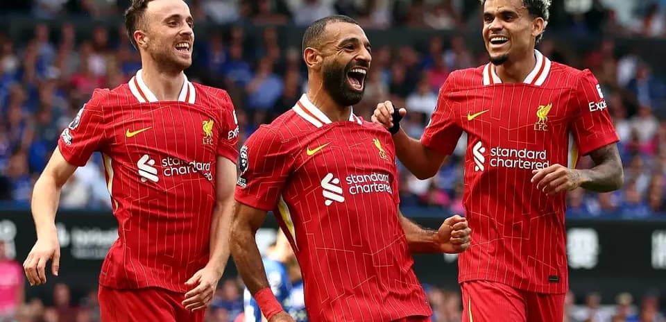 Liverpool players celebrating a goal together