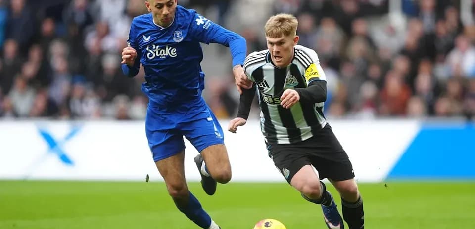 Two players competing for the ball during match