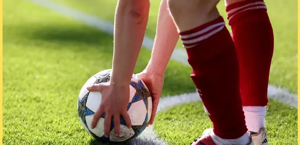 Player preparing to take a corner kick