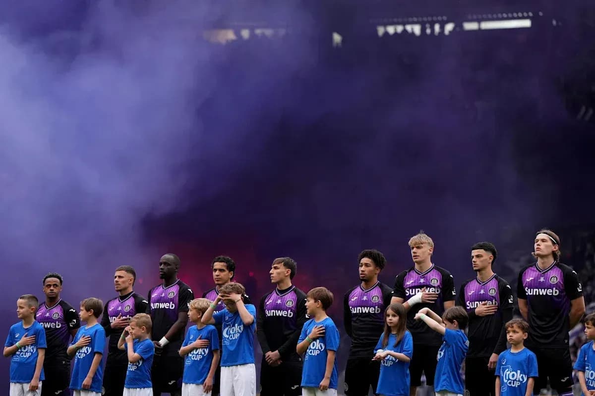 Team lineup with children during pre-match ceremony
