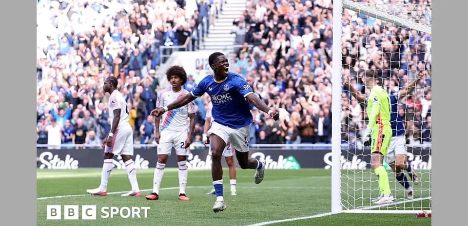 Player celebrating goal with fans in background