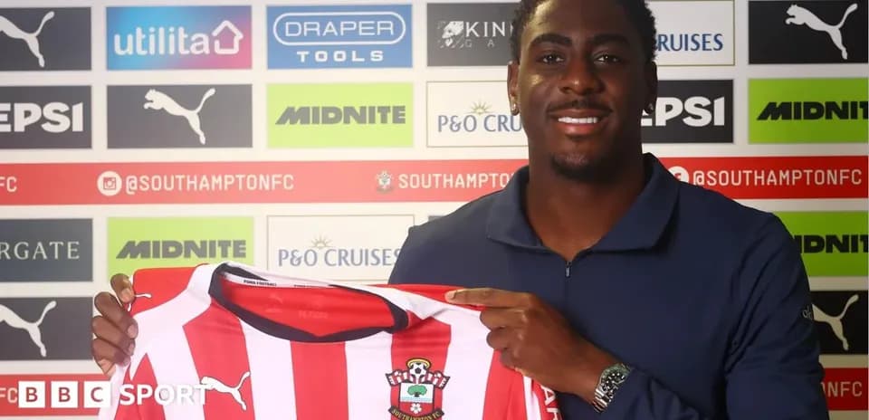 Player holding Southampton FC jersey at signing event