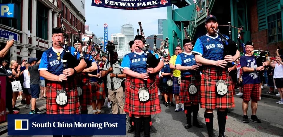 Bagpipe players in kilts parading at Fenway Park