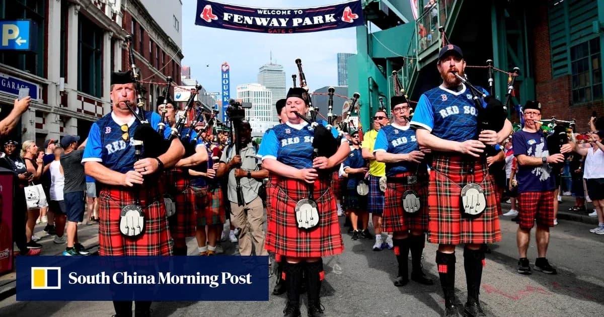 Bagpipe players in kilts parading at Fenway Park