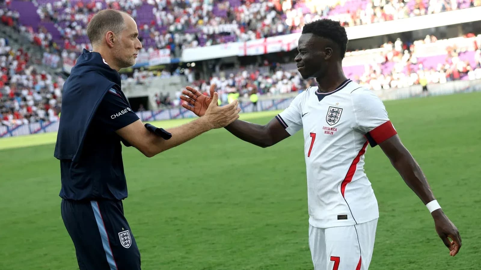 Coach and player exchanging handshakes after match