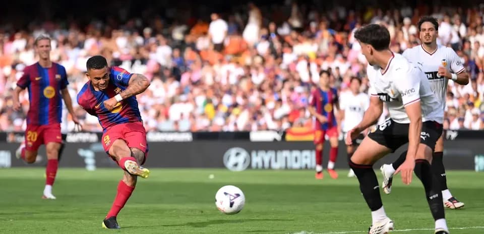 Barcelona player shooting during match against Valencia