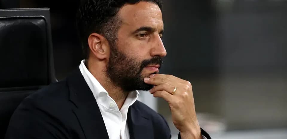 Man in suit contemplating during a match