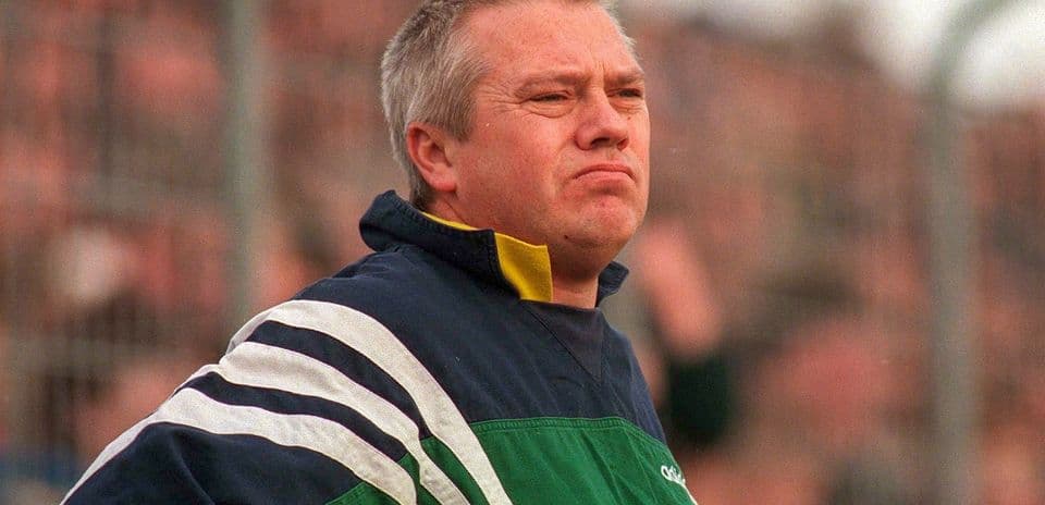 Coach observing match from the sidelines