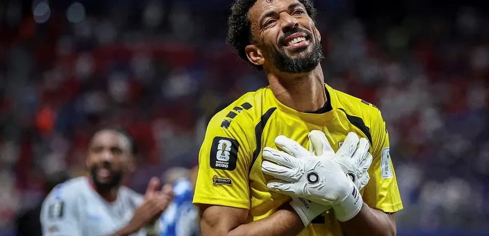 Goalkeeper celebrating with hands on chest after match