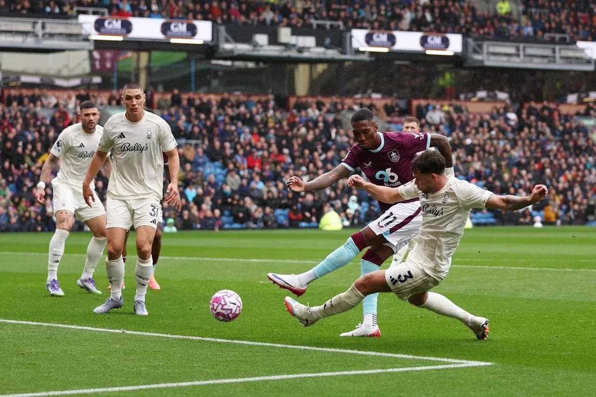Nottingham Forest player tackling Burnley forward