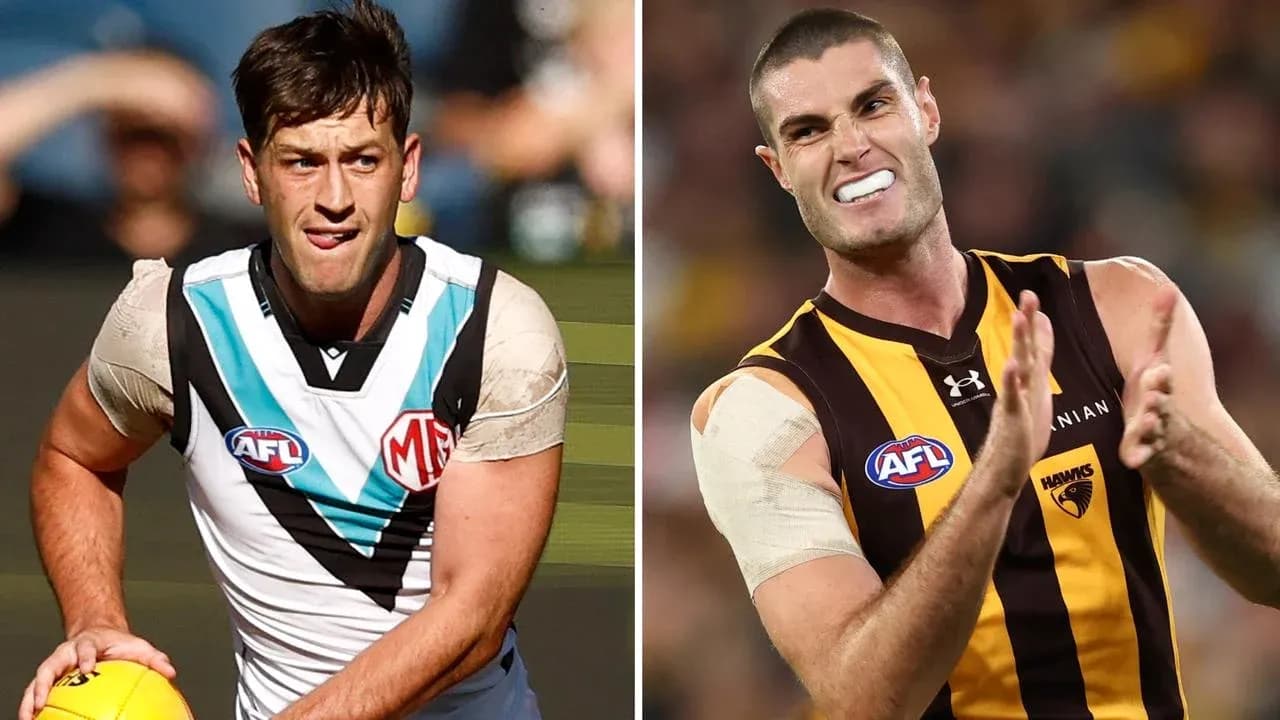 Two AFL players in action during a match