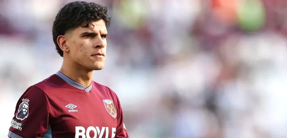 Player in West Ham United kit on the pitch
