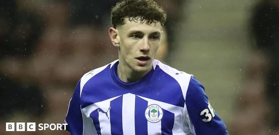 Player wearing Wigan Athletic jersey during match