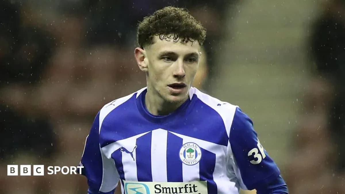 Player wearing Wigan Athletic jersey during match