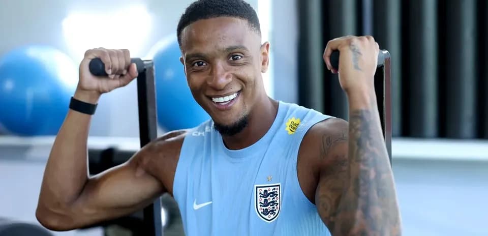 Player exercising with weights in training facility