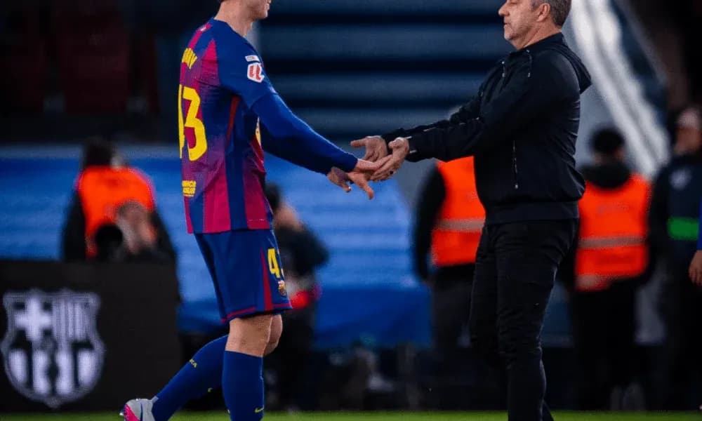 Player shaking hands with coach on the sideline