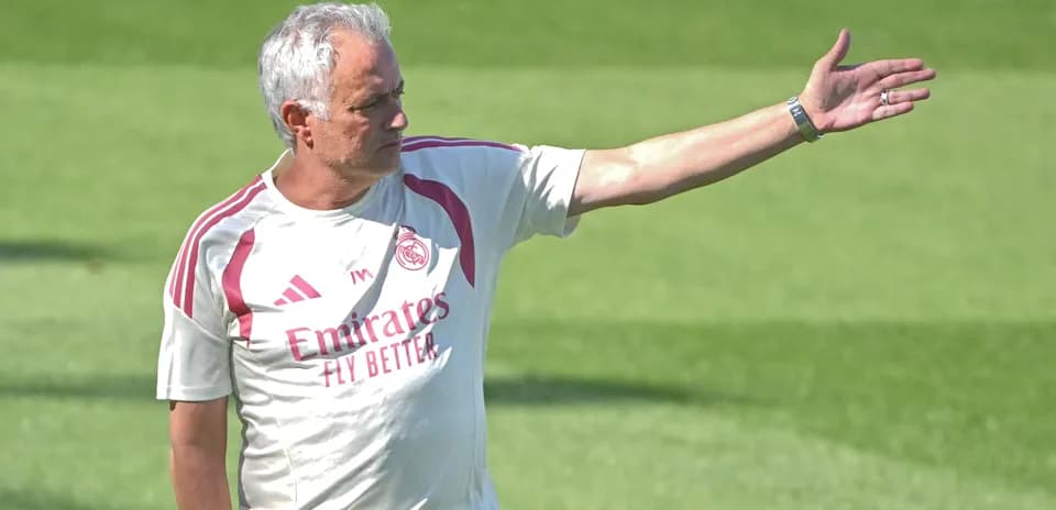 Coach gesturing during training session on field