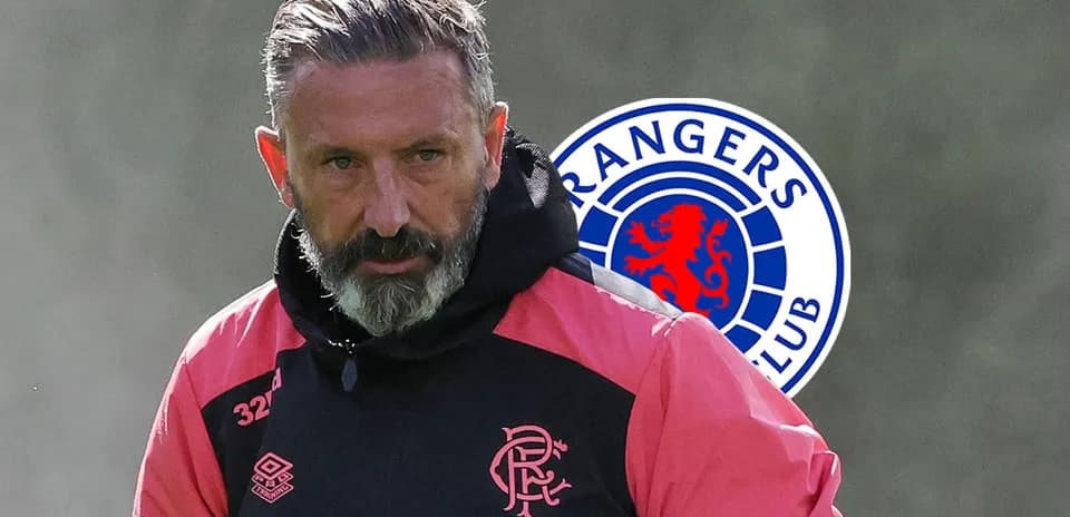 Football coach in training gear with Rangers logo