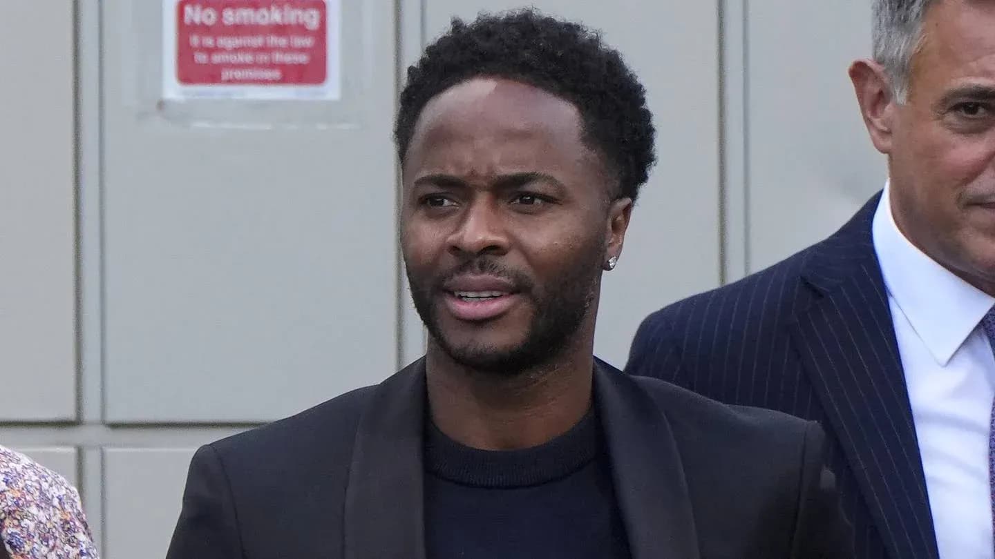 Man walking outdoors with suit and casual shirt