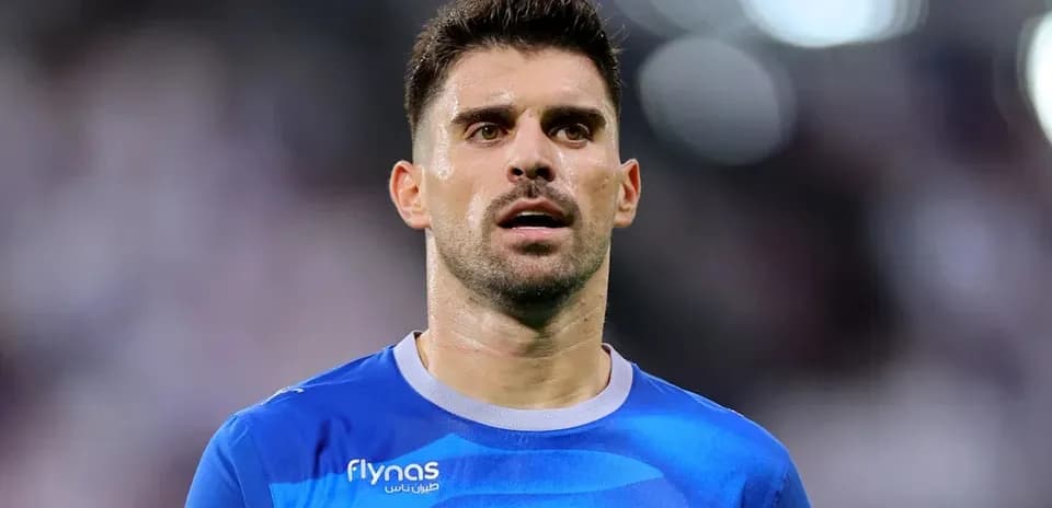 Football player in blue jersey during match